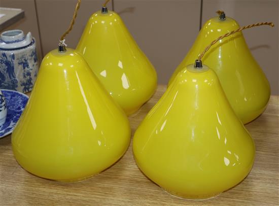 A set of four glass pear shaped light shades height 22cm